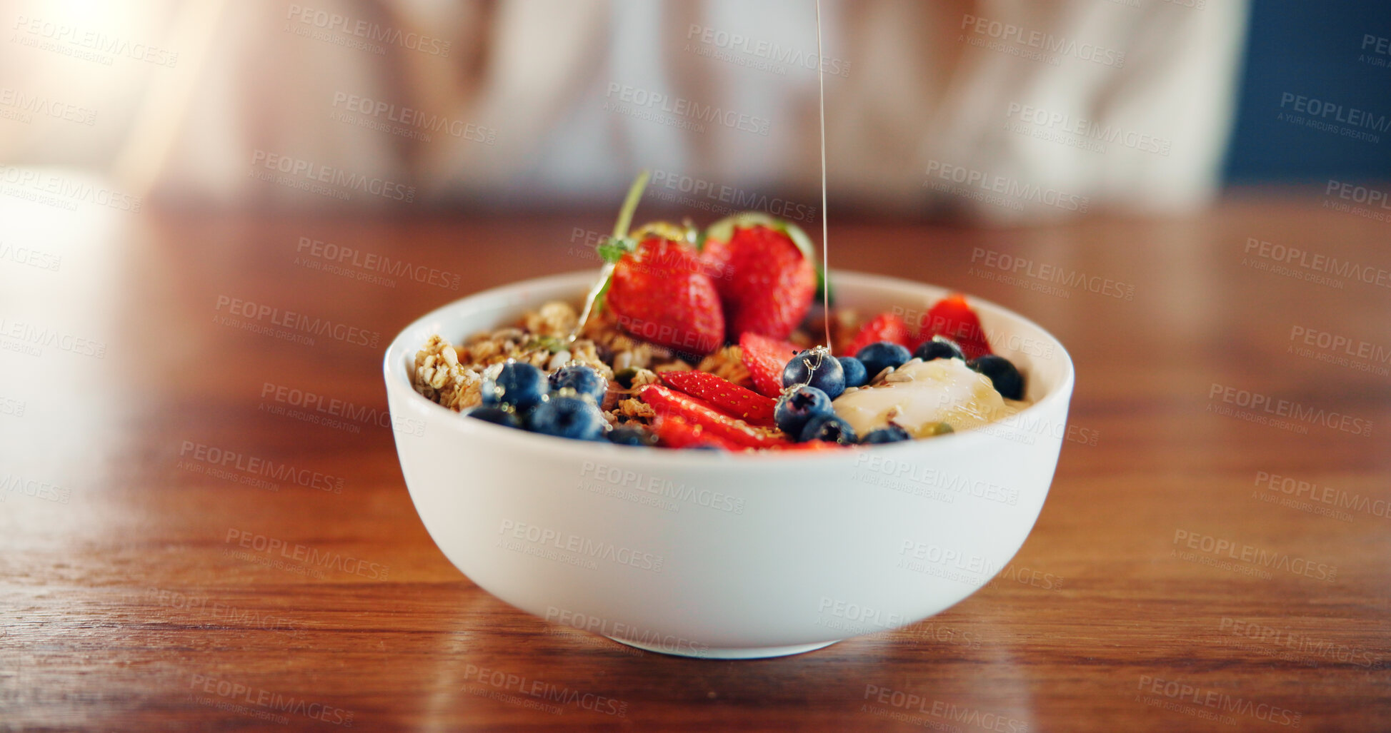 Buy stock photo Granola, diet and fruit muesli on kitchen counter for weight loss, wellness and nutrition for breakfast. Closeup, bowl and health food with protein, honey and detox in cereal and porridge in home