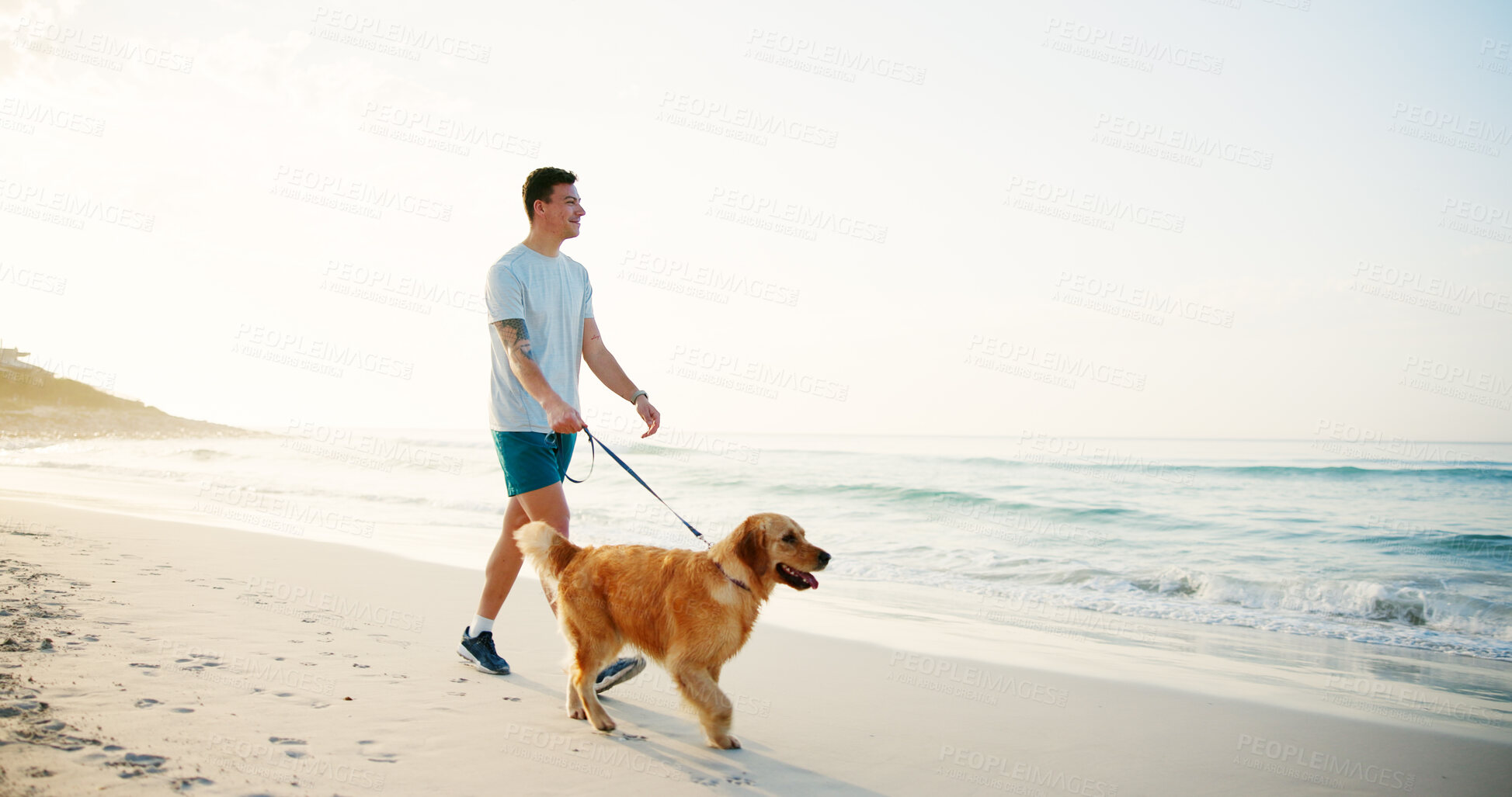 Buy stock photo Travel, man and walking with dog at beach for fun adventure, wellness exercise and bonding with companion. Mockup, owner and pet on leash by ocean for cardio workout, fresh air and exploring nature