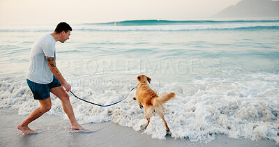 Buy stock photo Beach, man and running with dog in water for fun activity, wellness exercise and bonding with companion. Energy, owner and pet animal on leash by ocean for holiday adventure, fresh air and playing