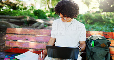 Buy stock photo Man, student and writing notes on park bench, laptop and study with project for online course. Person, computer and e learning for scholarship, exam and education with books for test in Costa Rica