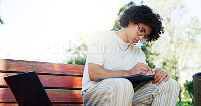 Buy stock photo Man, college student and writing notes on park bench, laptop and reading with project for online course. Person, computer and e learning for scholarship, exam and education with books in Costa Rica