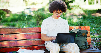 Buy stock photo Man, student and laptop in park for research assignment, university assessment and statistics project. Academic, computer and typing on bench for education, exam preparation and studying in Portugal