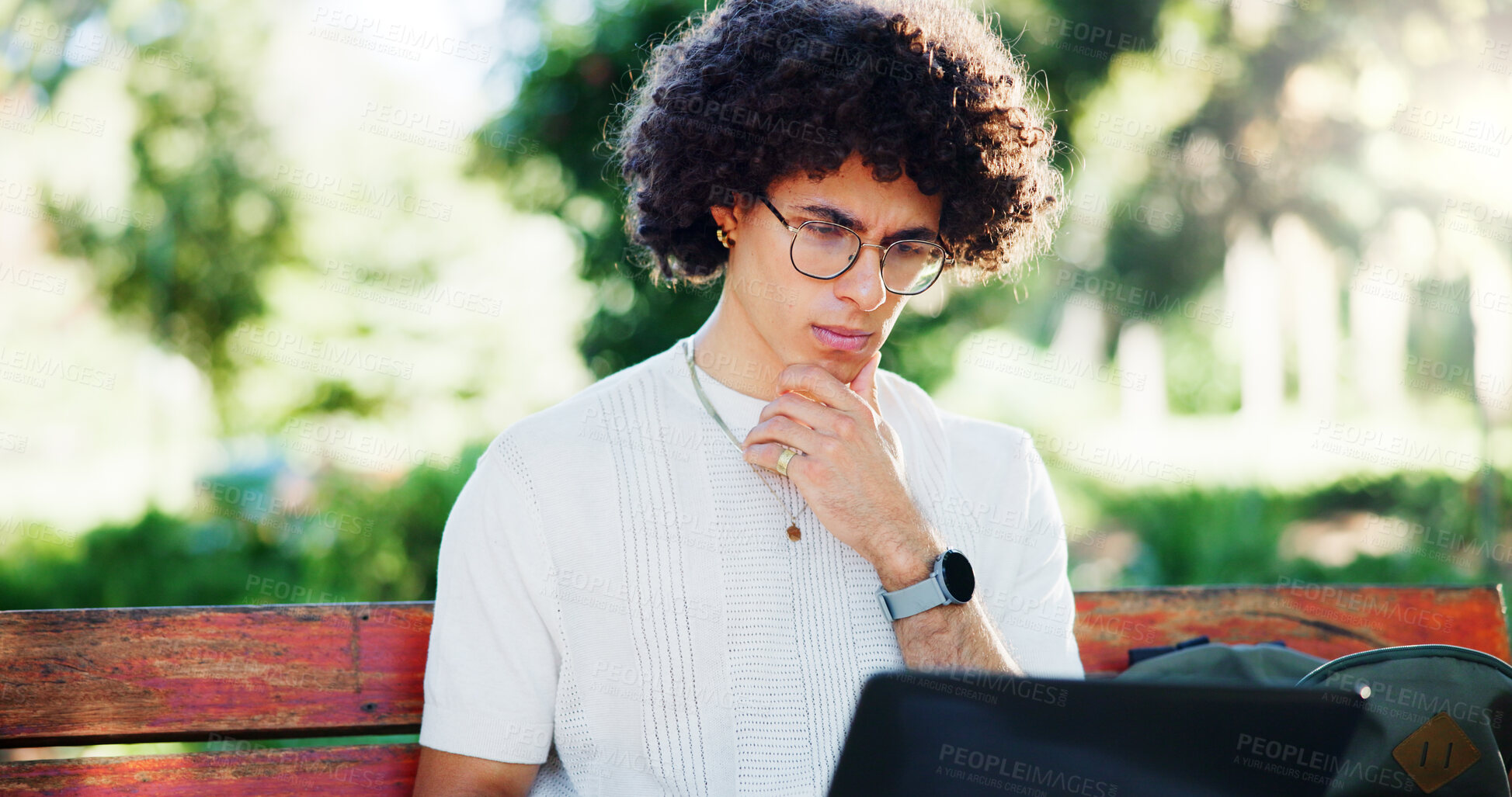 Buy stock photo Man, student and laptop for education on park bench for reading, project and online course. Person, computer and elearning on chair for scholarship, exam or thinking for problem solving in Costa Rica