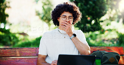 Buy stock photo Man, student and yawn with laptop, park and bench with, project for online course. Person, computer and tired with elearning, scholarship and exhausted with burnout, fatigue and study in Costa Rica