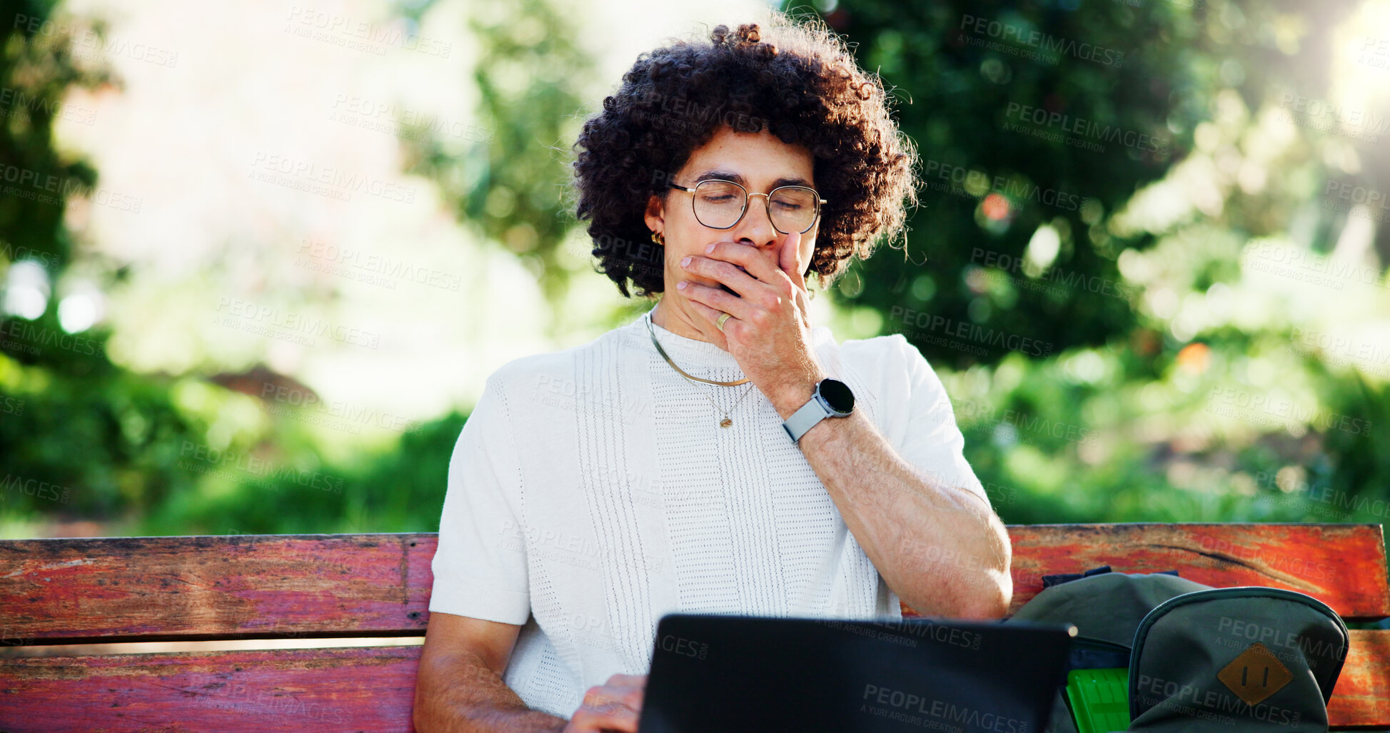 Buy stock photo Man, student and yawn with laptop, park and bench with, project for online course. Person, computer and tired with elearning, scholarship and exhausted with burnout, fatigue and study in Costa Rica