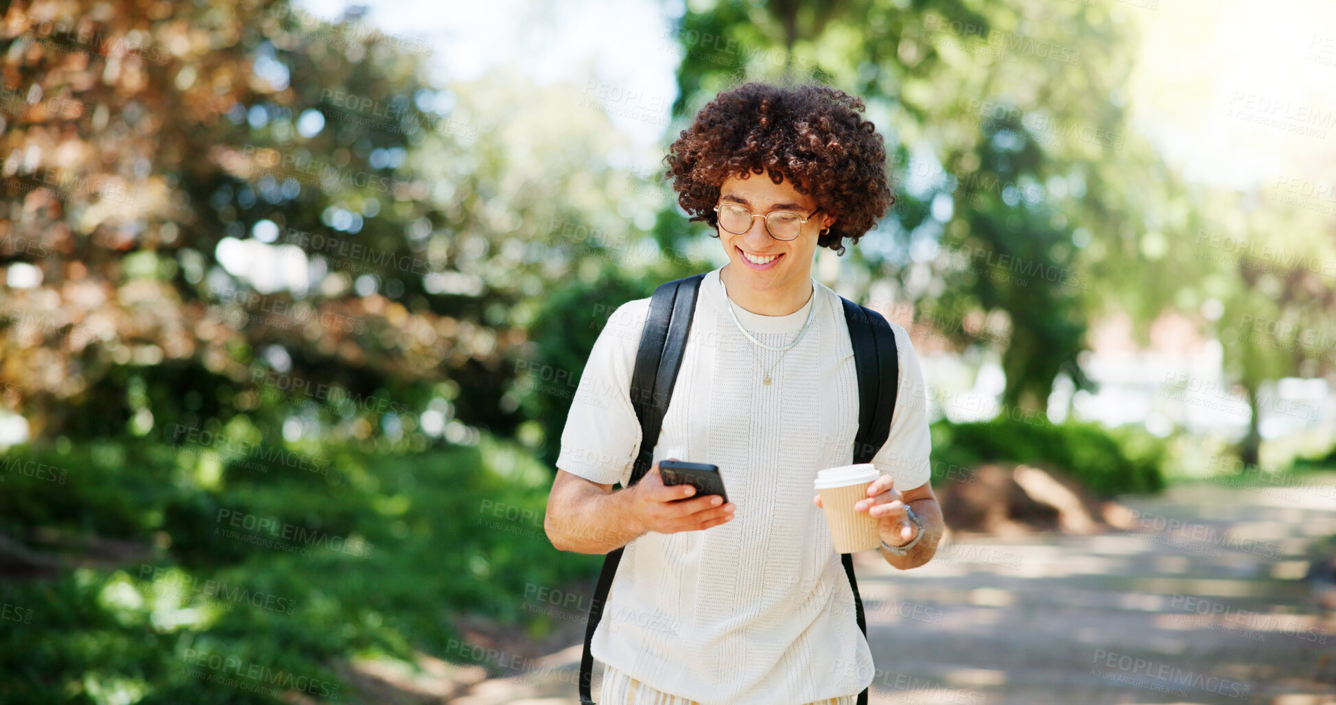 Buy stock photo Man, student and phone with smile on park, reading and coffee on walk with mobile app in morning at college. Person, smartphone and happy with chat, contact and social network at campus in Costa Rica