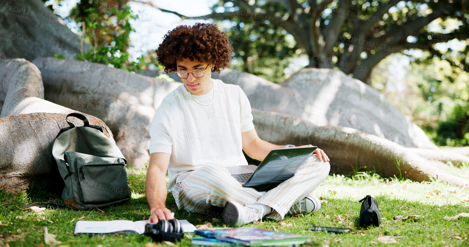 Buy stock photo Education, laptop and notebook with man student outdoor on college or university campus to study. Computer, learning and recess with scholarship person at school for academic development or homework