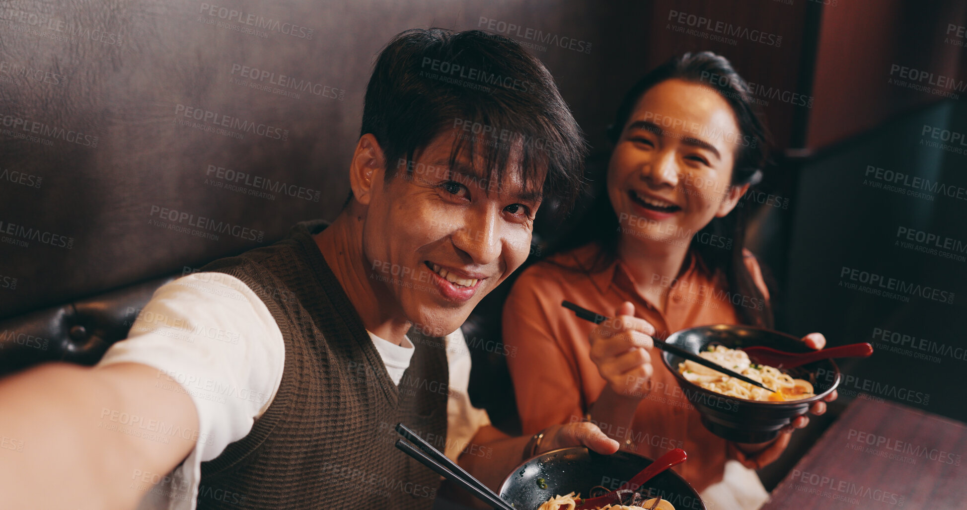 Buy stock photo Couple, portrait and selfie with food in restaurant, bonding and celebration for anniversary with smile. Japanese people, man and woman with joy for photography, picture and eating noodles on date