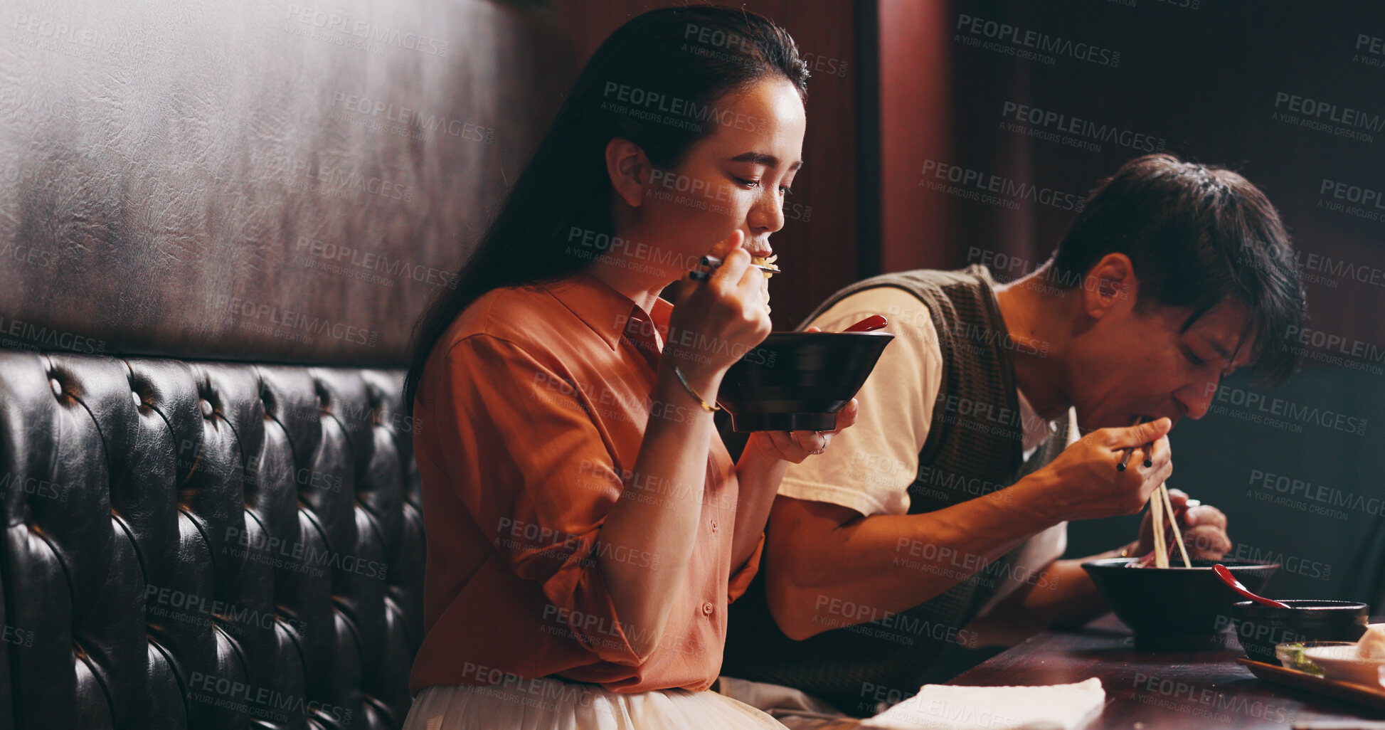 Buy stock photo Japanese couple, eating lunch and dish in restaurant for date, bonding together or healthy meal. Woman, man and hospitality for diet, traditional cuisine and chopsticks as ramen noodles or asian food