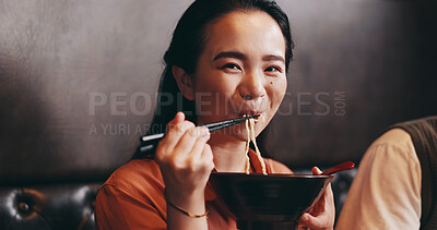 Buy stock photo Japanese woman, eating and portrait in restaurant for date, bonding together and healthy meal. Happy people, hospitality and diet with traditional cuisine, chopsticks and ramen noodles as asian food