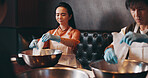 Couple, cooking and together on date in restaurant for culinary skills, learning and meal prep in bowl. Japanese people, bonding and raw ingredients in cafe for ramen noodles class and experience