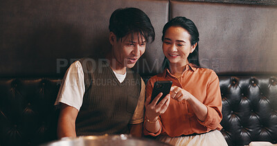 Buy stock photo Japanese, couple and happy with smartphone for restaurant, online menu or service with conversation. Valentines day, man or woman with mobile application for digital order, options or bonding on date