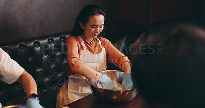 Buy stock photo Cooking, food and mixing with Japanese woman in restaurant for catering, bowl and fine dining. Dinner menu, nutrition and chef with Asian person in class for meal prep, culture and traditional diet 