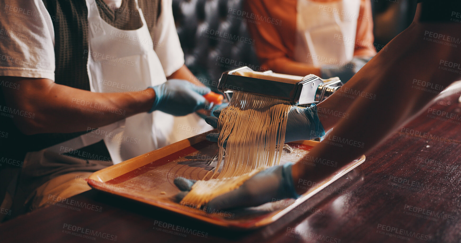 Buy stock photo Hands, ramen and meal prep with noodle cutter, cooking class and chef in Japanese restaurant for lunch. People, process and culinary skills as customer in hospitality, diet and healthy food for dish