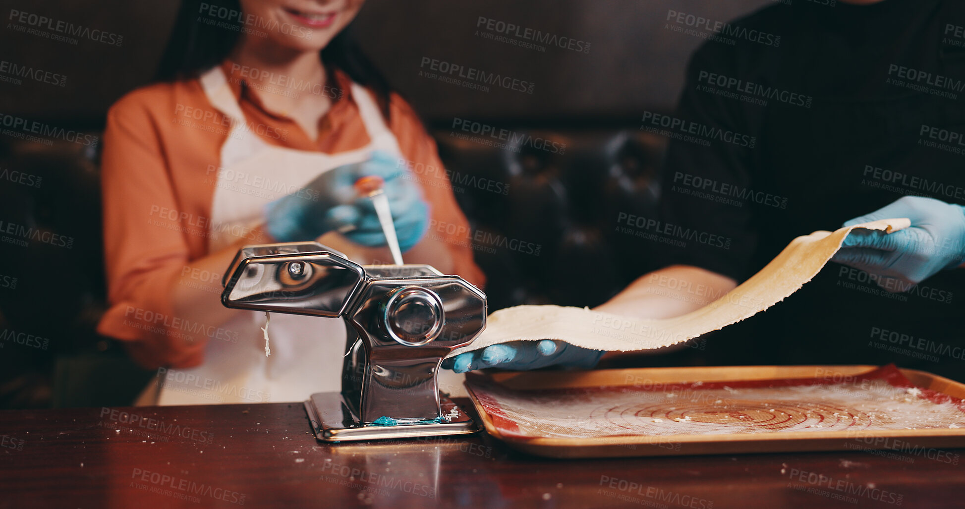 Buy stock photo Woman, dough and meal prep with noodle cutter, cooking class and chef in Japanese restaurant for lunch. People, together and culinary skills as customer in hospitality, diet and healthy food for dish