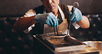 Japanese restaurant, cooking and hands preparing noodles for traditional cuisine, culinary culture and lunch meal. Chef, gloves and person steaming ramen in appliance for nutrition and healthy dinner