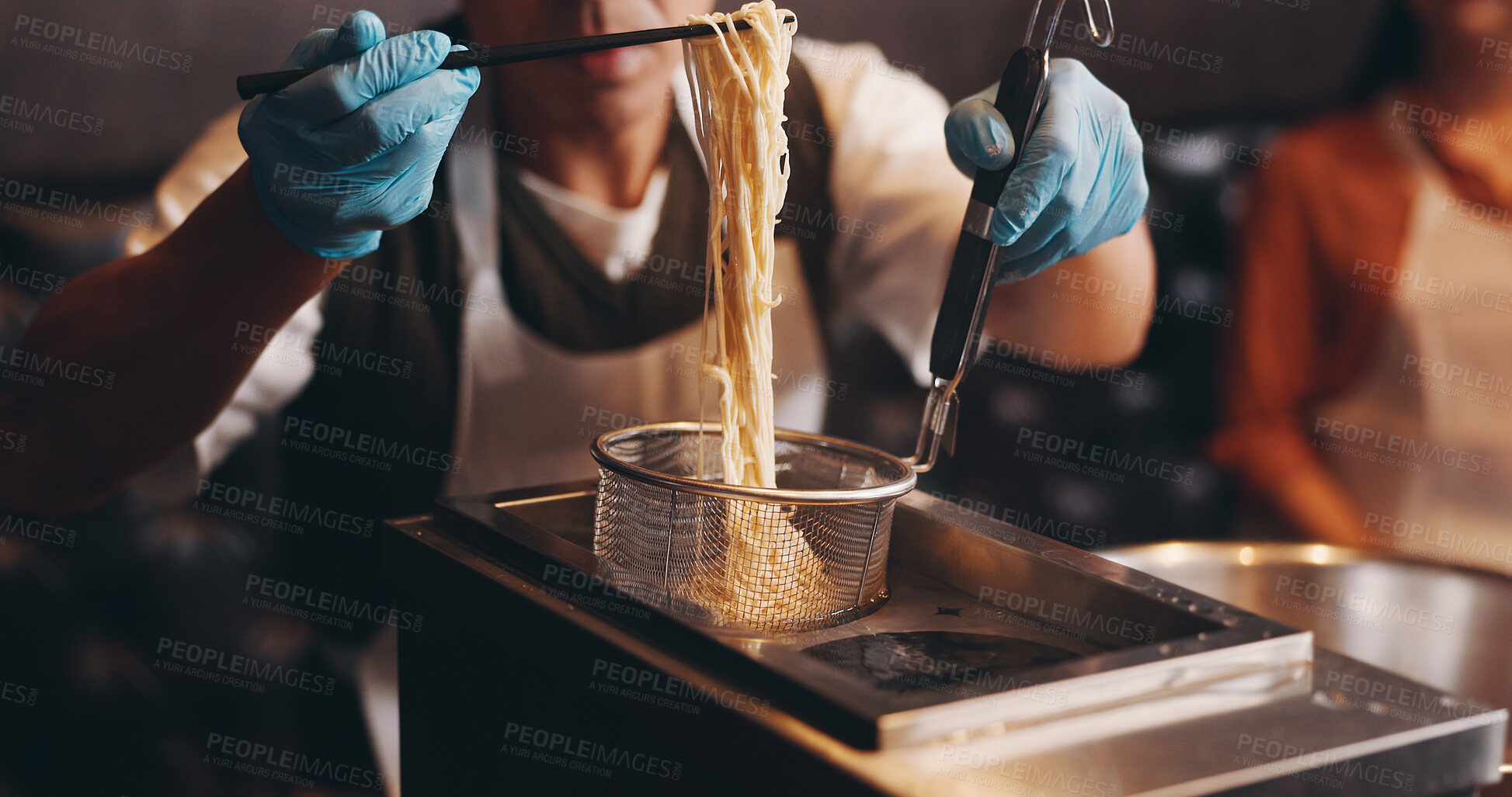 Buy stock photo Japan, restaurant and hands cooking noodles for traditional cuisine, culinary culture and meal preparation. People, gloves and steaming ramen with chopsticks for nutrition, lunch and healthy dinner