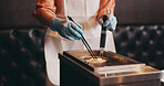 Japan, restaurant cooking and hands boiling noodles for traditional cuisine, culinary culture and meal preparation. Chef, gloves and person steaming ramen in strainer for nutrition and healthy dinner