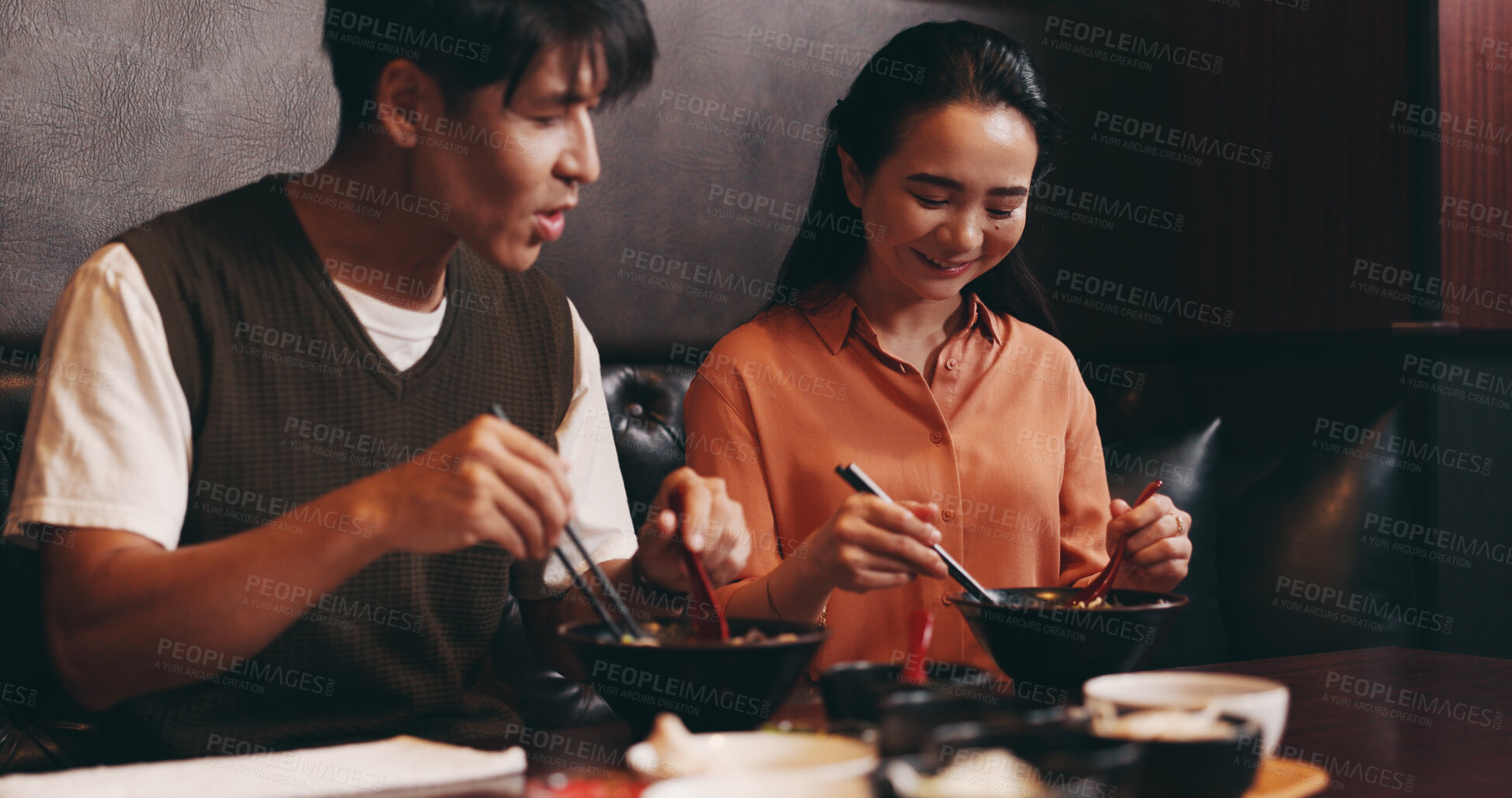 Buy stock photo Japanese, happy couple and eating lunch with ramen noodles for date, asian food and healthy meal. Woman, man and culture for diet, traditional cuisine and chopsticks in restaurant or bonding together