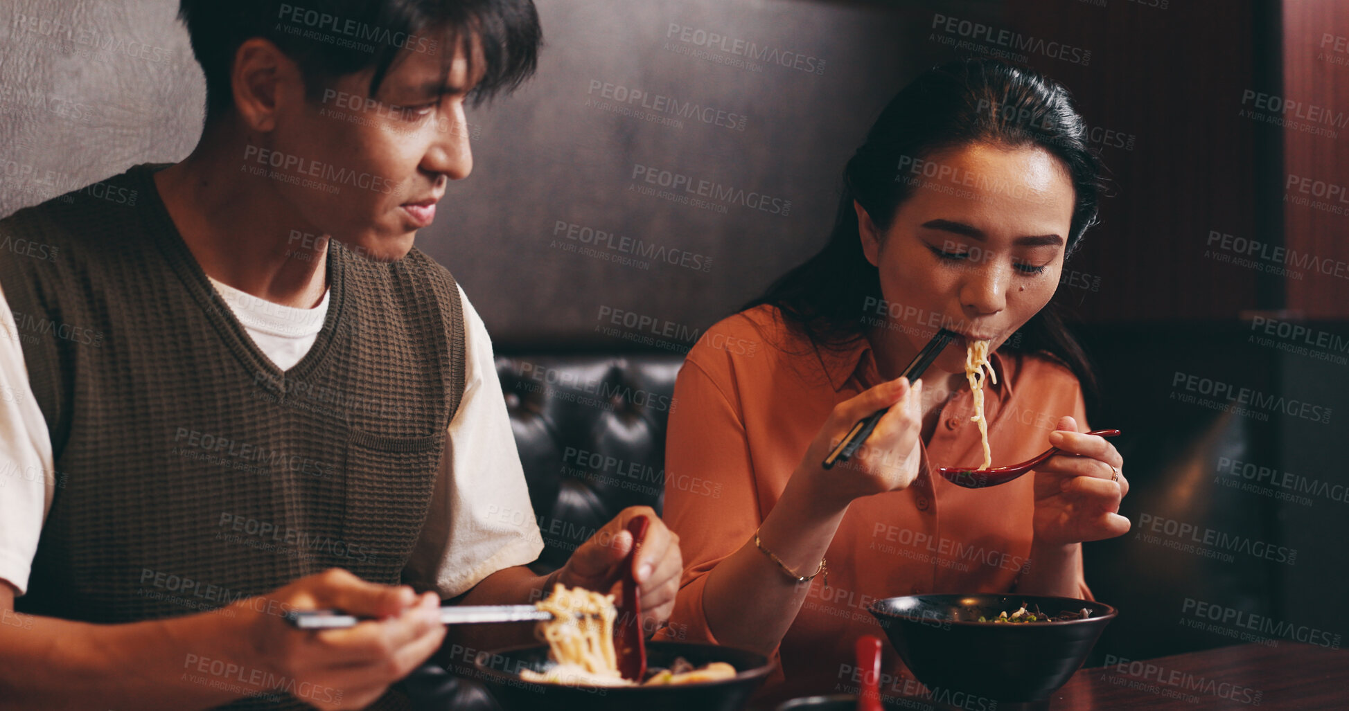 Buy stock photo Eating, ramen and Japanese couple at restaurant with food, date and lunch with soup. Hungry, table and bowl with meal, asian cuisine and customer with chopsticks and healthy dish for nutrition