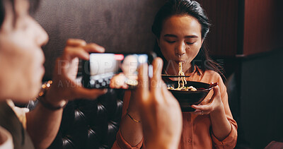 Buy stock photo Couple, food or eating on camera in restaurant for live recording, tasting cuisine or traditional meal vlog. Japanese people, influencer and phone screen for ramen bowl taste test or content creation