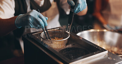 Buy stock photo Japanese restaurant, cooking and hands boiling noodles in kitchen for traditional cuisine, culinary culture and meal prep. Chef, gloves and steaming ramen in strainer for nutrition and healthy dinner