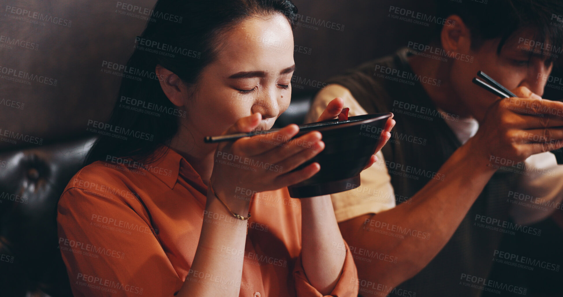 Buy stock photo Japanese, happy couple and eating with ramen noodles for lunch date, asian food or healthy meal. Woman, man and culture for taste, traditional cuisine and chopsticks in restaurant or bonding together