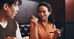 Japanese, happy couple and eating lunch in restaurant for date, bonding together and healthy meal. Woman, man and thumbs up for diet, traditional cuisine and chopsticks as ramen noodles or asian food