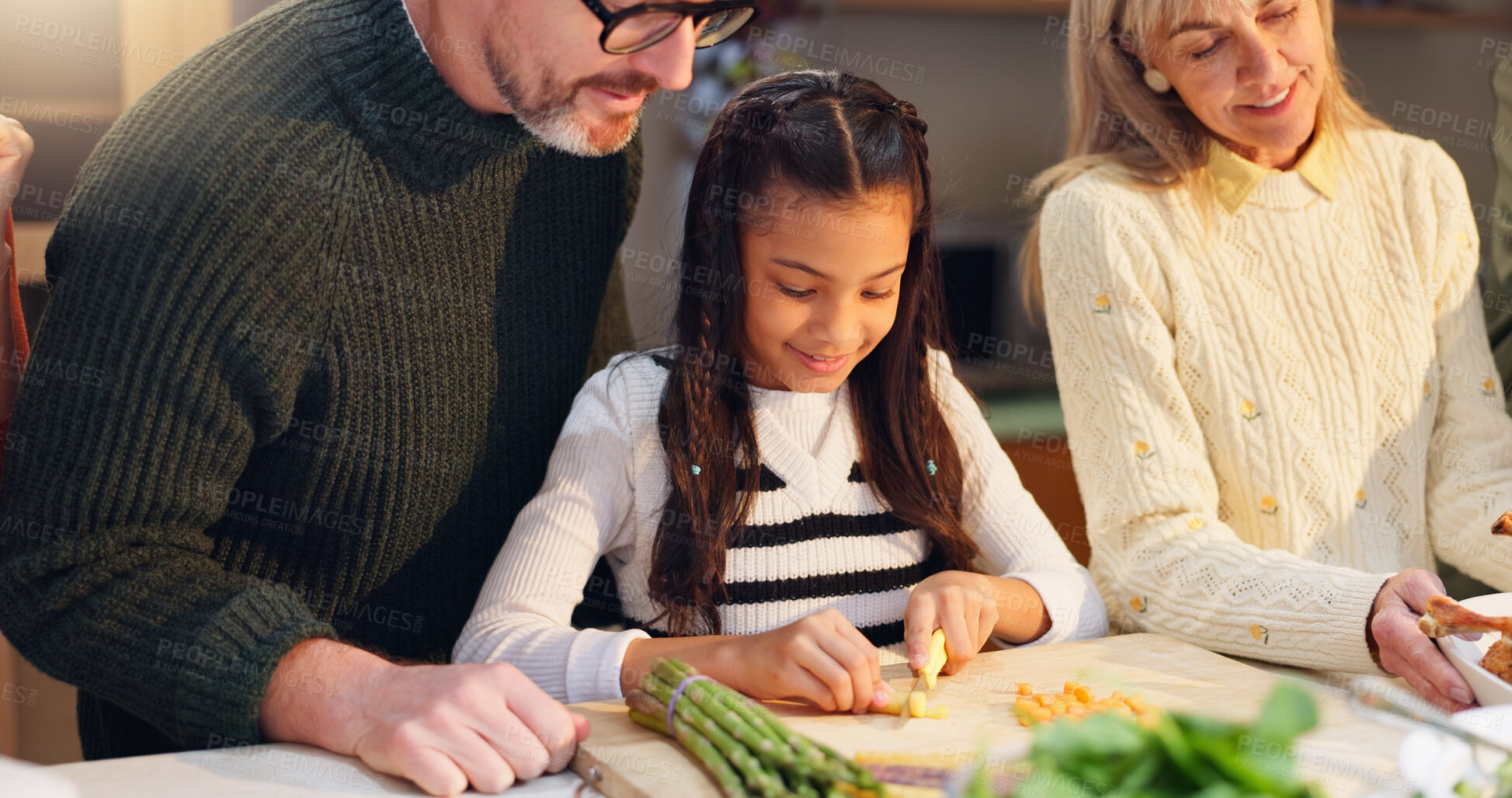 Buy stock photo Happy family, helping and child with grandmother, cooking and food for teaching or development in house. Girl, father and vegetables for dinner, meal prep or learning in home for bonding or education