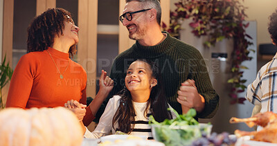 Buy stock photo Happy family, talking and fun for thanksgiving with children, event and food for holiday or vacation. Feast, people and interracial parents at dinner party, reunion and gathering for bonding in home