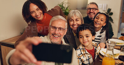 Buy stock photo Thanksgiving, food and selfie of family in home for lunch, supper and Christmas dinner together. Happy, picture and grandparents, parents and kid with memory for festive event, holiday or celebration