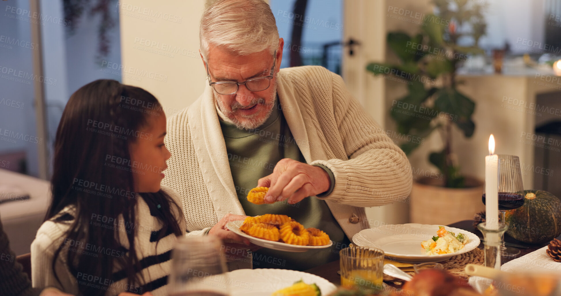 Buy stock photo Home, grandfather and child with food for thanksgiving, festive feast and holiday celebration as family. House, dish and man with girl with serving for nutrition, bread and bonding with dinner meal