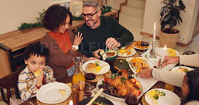 Buy stock photo Happy family, dinner and thanksgiving celebration with kids, festive holiday and food for vacation. Feast, people and interracial parents at party, reunion and gathering for bonding or event in home