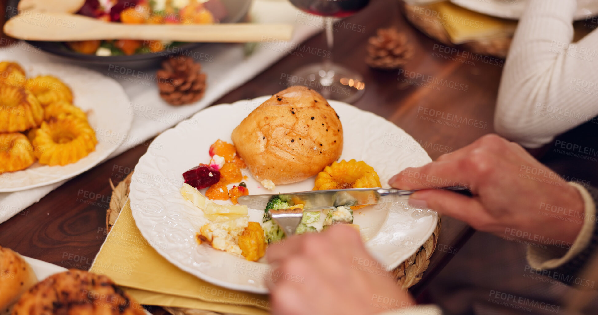 Buy stock photo Thanksgiving, family and hands on table with food for lunch, supper and eating meal at home together. Christmas, dinner and person with vegetables on plate for festive tradition, holiday or gathering