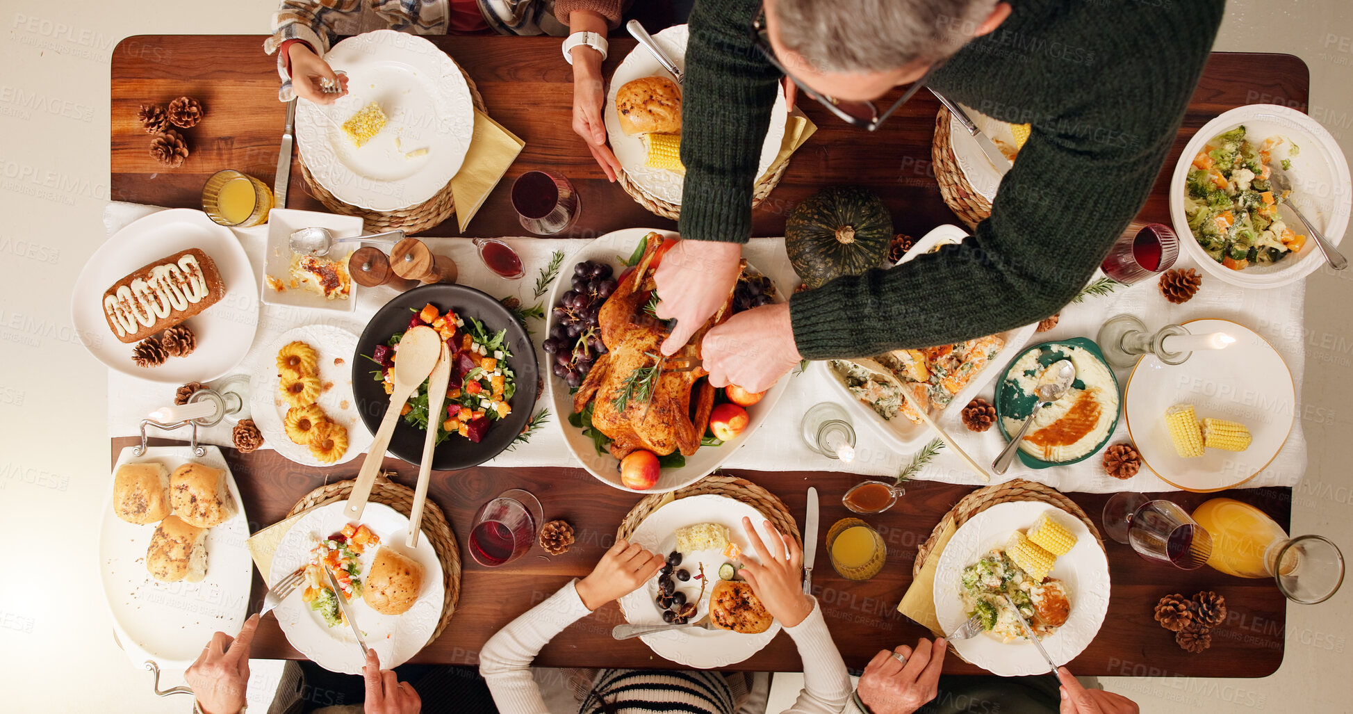 Buy stock photo Above, chicken and festive with family and food for celebration, support and thanksgiving holiday. Catering, nutrition and reunion with people and cutting at home for eating, hosting and health