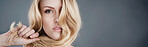 Banner, haircare and portrait of woman, studio and treatment for shine, confident and texture of hairdo. Mockup space, serious and growth of hair in grey background, hairstyle and salon in Canada