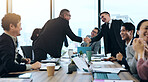 Business people, handshake and success in office as group for contract, achievement or investment. Team, finance and partnership for deal, collaboration and meeting in project management or corporate