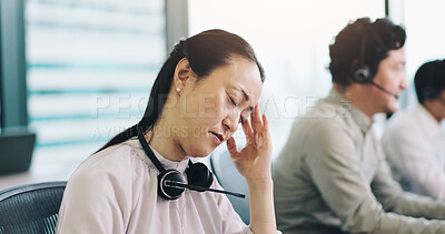 Buy stock photo Telemarketing, business and woman in office, headache and stress with burnout, customer service and tired. Japanese person, insurance consultant and agent with migraine, overworked or tech support