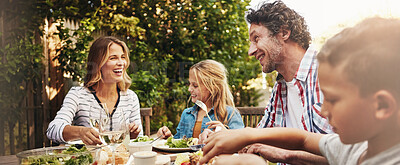 Buy stock photo Happy, parents and children at outdoor lunch with smile, celebration or family eating together in backyard. Mother, father and kids at table for garden picnic with food, laughing or bonding on banner