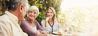 Buy stock photo Happy, lunch and mother with senior parents in backyard for brunch, supper and eating together. Family home, banner and people at table with food bonding at Thanksgiving, Christmas and festive party