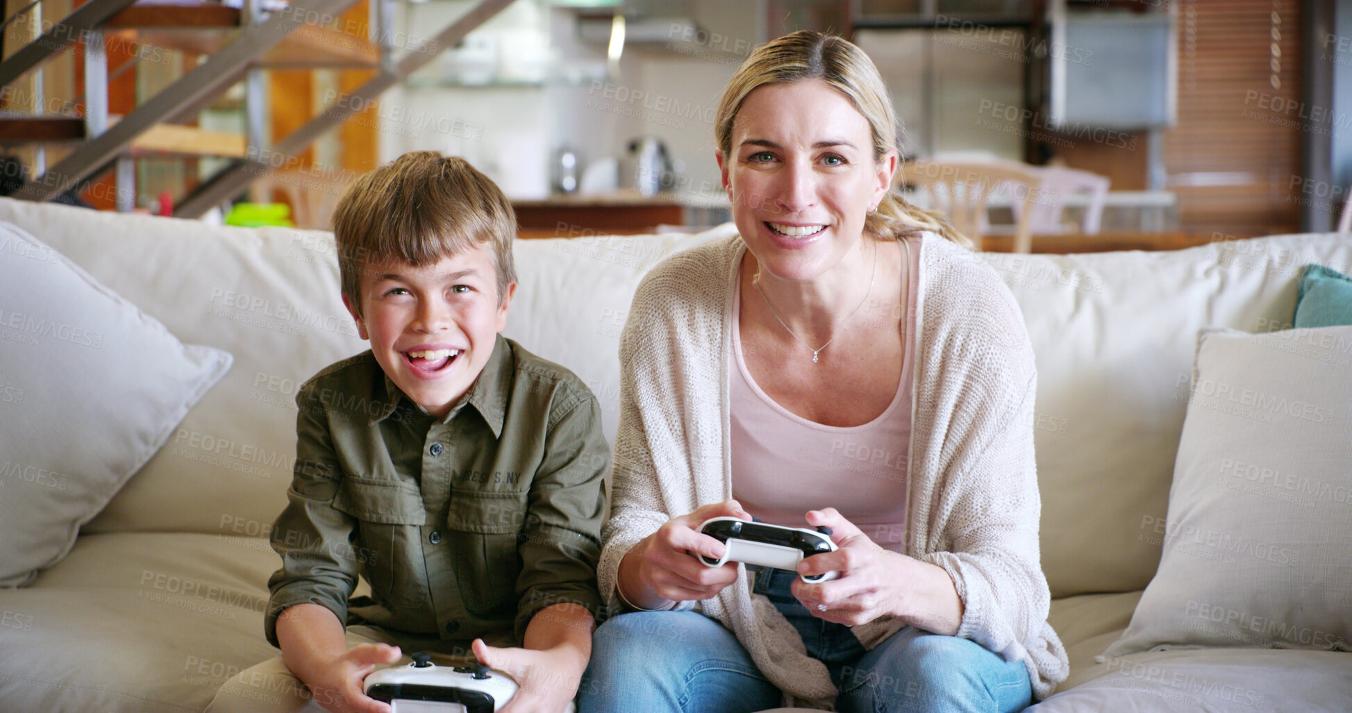 Buy stock photo Mother, son and video game on sofa, happy and playful with contest, bonding and love family home. Mom, boy child and smile with controller, console and excited for challenge on lounge at apartment