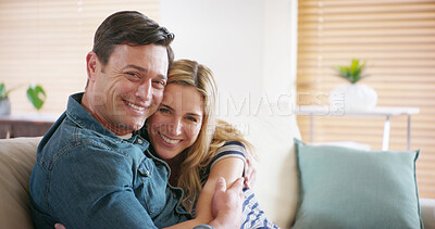 Buy stock photo Portrait, smile and couple hug in home for love, support or romantic connection to partner in marriage. Face, happy man and woman embrace in living room for loyalty, trust and commitment in Germany