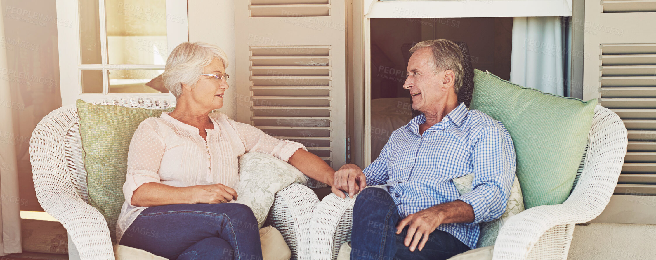 Buy stock photo Senior couple, holding hands and relax in home with love, bonding or trust on patio banner. Marriage, elderly people or support on porch with retirement comfort, sharing memories or relationship care