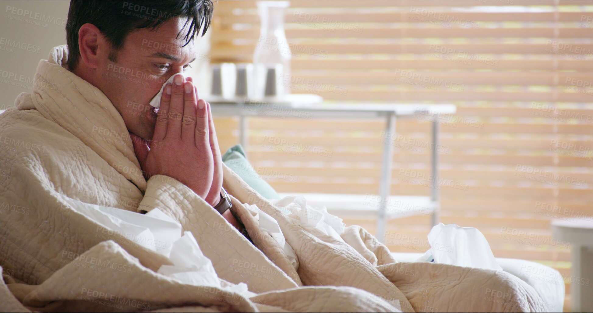 Buy stock photo Living room, allergies and man with tissue, home and sneezing with runny nose, infection and virus. Lounge, winter and symptoms of fever, sickness and health of person with sinus and warm in house