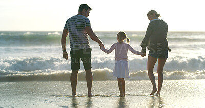 Buy stock photo Holding hands, family and vacation to relax, beach and waves in morning, bonding and child with parents and love. Holiday, water and people with daughter, back and care for kid, sea and California