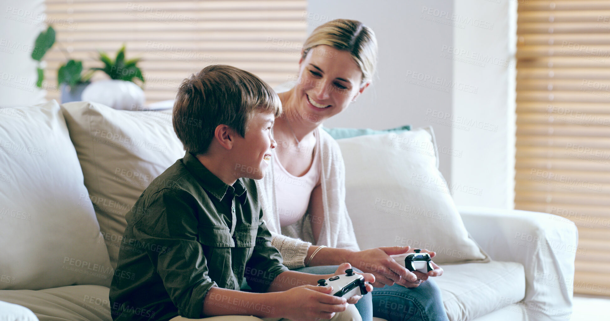 Buy stock photo Happy, mom and child with controller, video game and bonding with tech, fun and competitive in house. Lounge, gamer and woman with console, kid and subscription for family, electronics and home