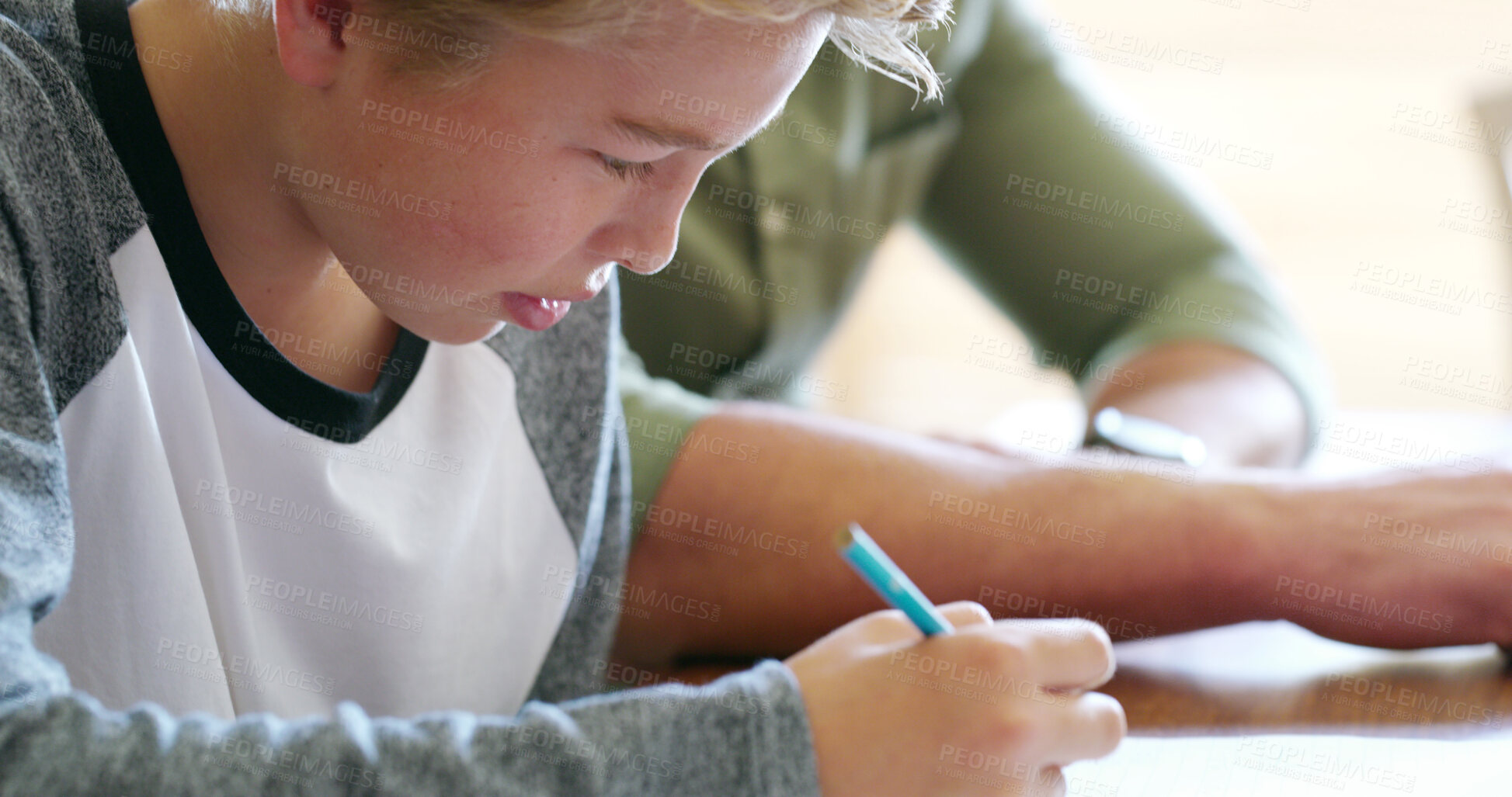 Buy stock photo Boy, child and homework with writing in home for learning, development and problem solving with parent. Kid, pencil and paper with education, studying and progress with assessment at family house