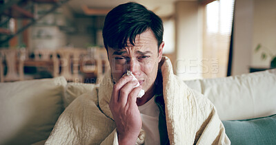 Buy stock photo Man, sick and portrait in home with tissues, Covid 19 symptoms and flu season on sofa. Person, blanket and self care in living room with virus, spring allergies and sneezing with medical condition