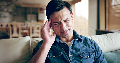 Buy stock photo Man, stress and headache in home with worry, sickness and medical condition on sofa. Male person, migraine and pain in living room for emergency, anxiety and massage temple for relief of illness