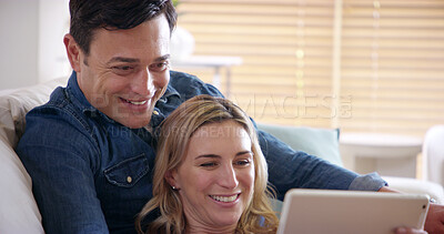 Buy stock photo Smile, couple and tablet on sofa in home with video streaming, series and technology from meme. Internet, watching and love of happy people with app, online and fun together on weekend with care